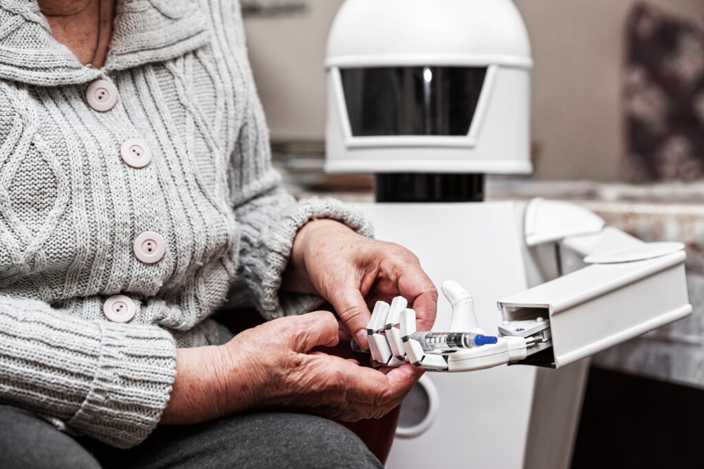 Roboter gibt Medikamente aus; Foto: AdobeStock/M. Dörr, M. Frommherz